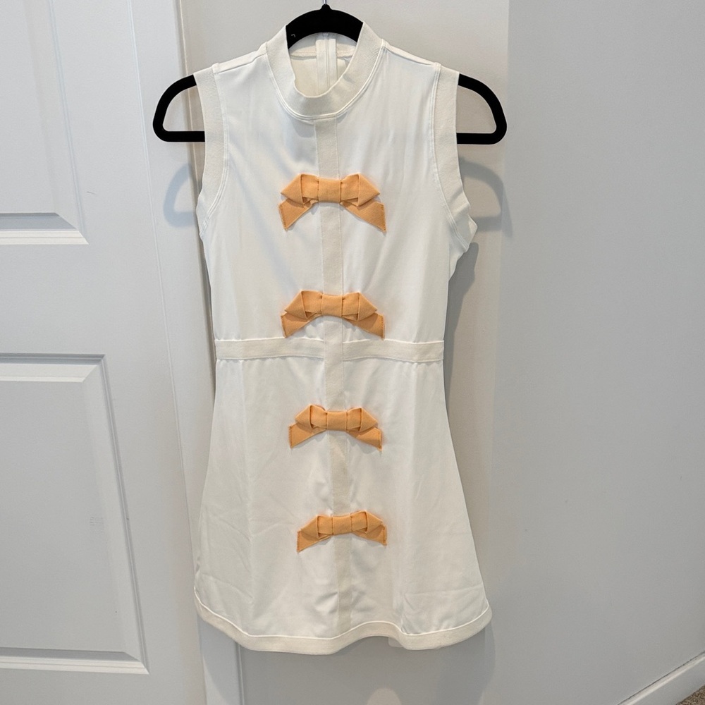 Sleeveless White Dress with Yellow Bow Accents